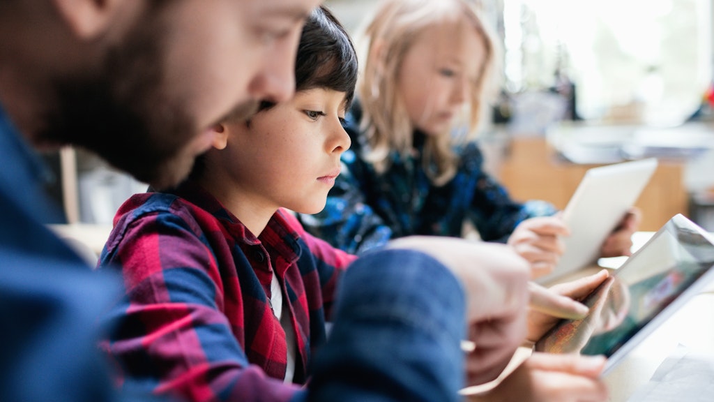 Topic Guides Main Stock Teacher and students on computers 2 681888161